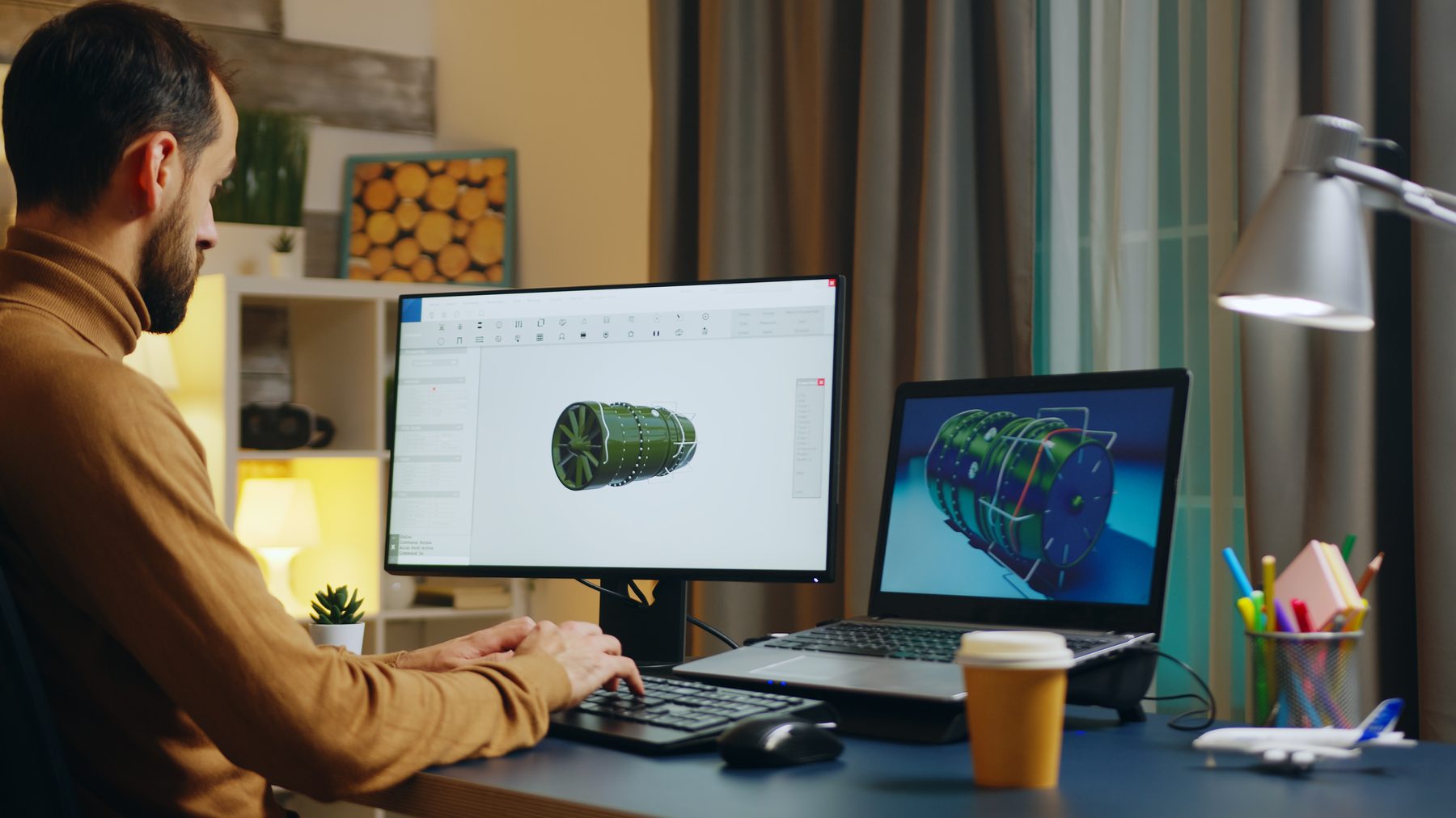 Engineer modelling a turbine assembly in CAD